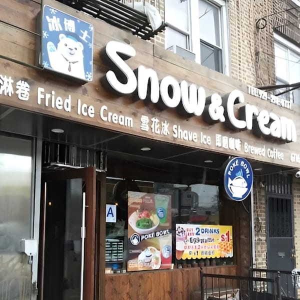 Exterior of Snow & Cream dessert shop with a polar bear logo and signs for fried ice cream and poke bowls.